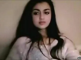 Beautiful Indian woman with long black hair in will not hear of shroud sitting on a bed porn video